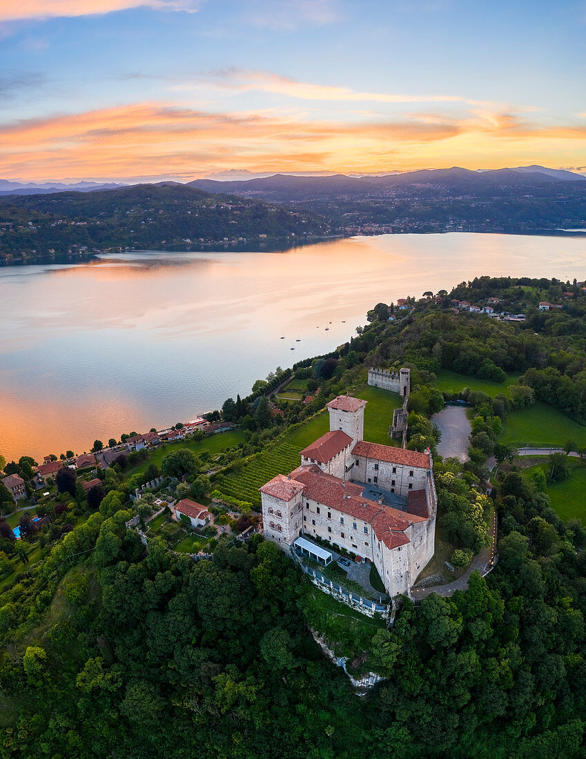 View of the fortress called Rocca di Angera during a spring sunset. Angera, Lake Maggiore, Varese district, Lombardy, Italy.
