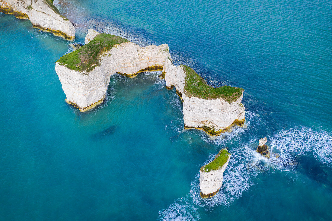 Aerial view at sunrise of the Old Harry Rocks, chalky formations near  Handfast Point, on the Isle of Purbeck in Dorset, Jurassic Coast, southern England. 