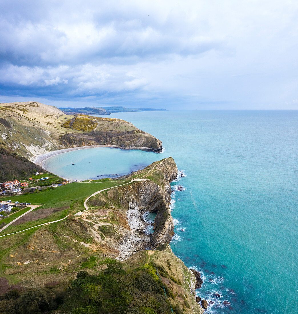 Aerial view of Lulworth Cove with Cathedral Cavern and Stair Hole, chalky formations near  West Lulworth, on the Isle of Purbeck in Dorset, Jurassic Coast, southern England. 