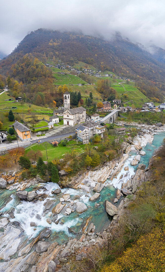 Aerial view of rapids on river Verzasca and the church of Lavertezzo, Valle Verzasca, Canton Ticino, Switzerland.
