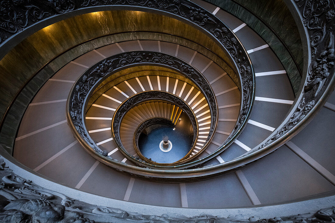 View of the Bramante Staircase, spiral stairs of the Vatican Museums, designed by Giuseppe Momo. Rome, Rome district, Lazio, Europe, Italy.