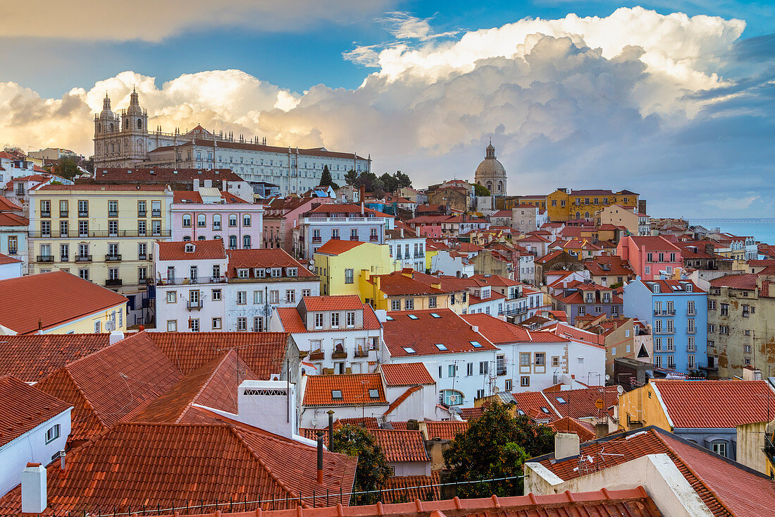 View of the roofs of Lisbon, the ancient monastery of São Vicente de Fora and the dome of the church of Santa Engrácia from Miradouro Alfama viewpoint. Lisbon, Portugal, Europe.