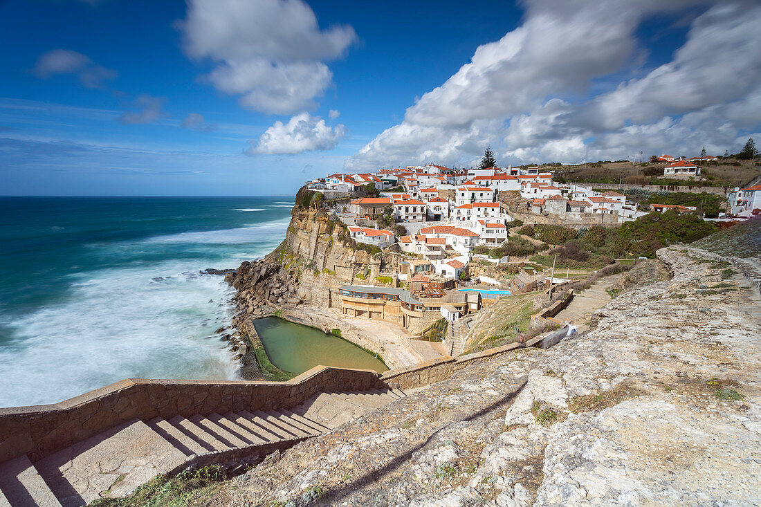 View of the town of Azenhas do Mar, located in front of the waters of the Atlantic Ocean. Sintra, Colares, Portugal, Europe.