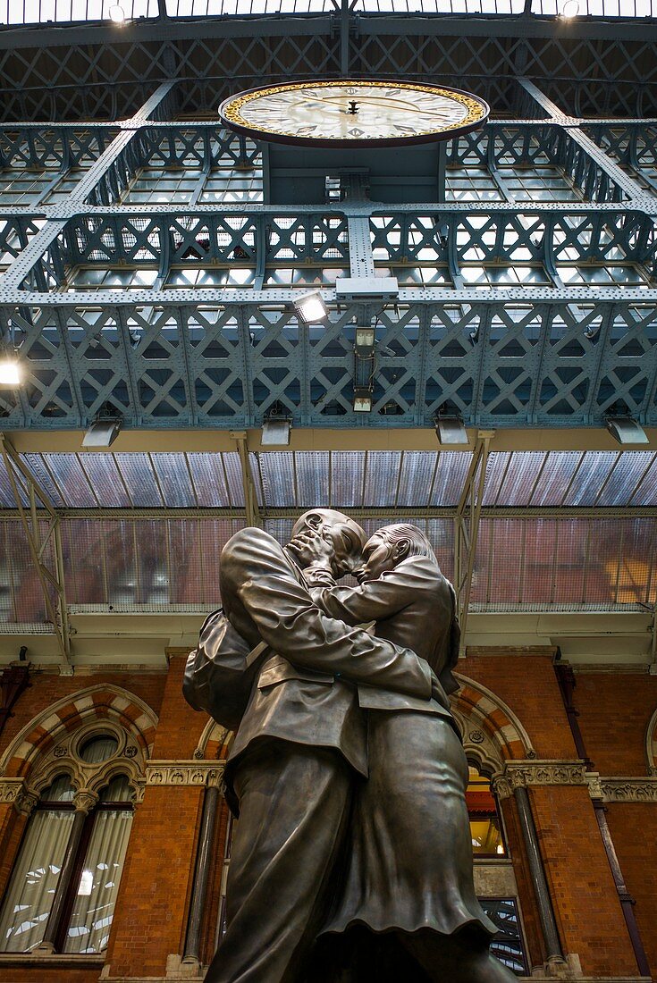 England, London, St Pancras, interior of St Pancras train station, sculpture, The Meeting Place, by Paul Day