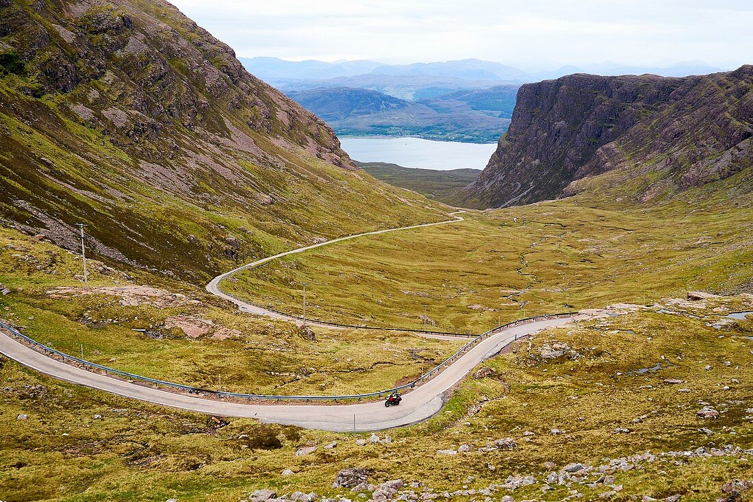 United Kingdom, Scotland, Highland, Wester Ross, Strathcarron, motorcycle on the Bealach na Bà road, a historic pass through the mountains of the Applecross peninsula