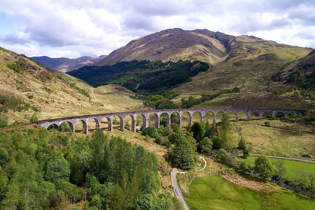United Kingdom, Scotland, Lochaber district, Glenfinnan, West Highland Railway, Glenfinnan viaduct, made famous in JK Rowling's Harry Potter as the Hogwarts Express (aerial view)