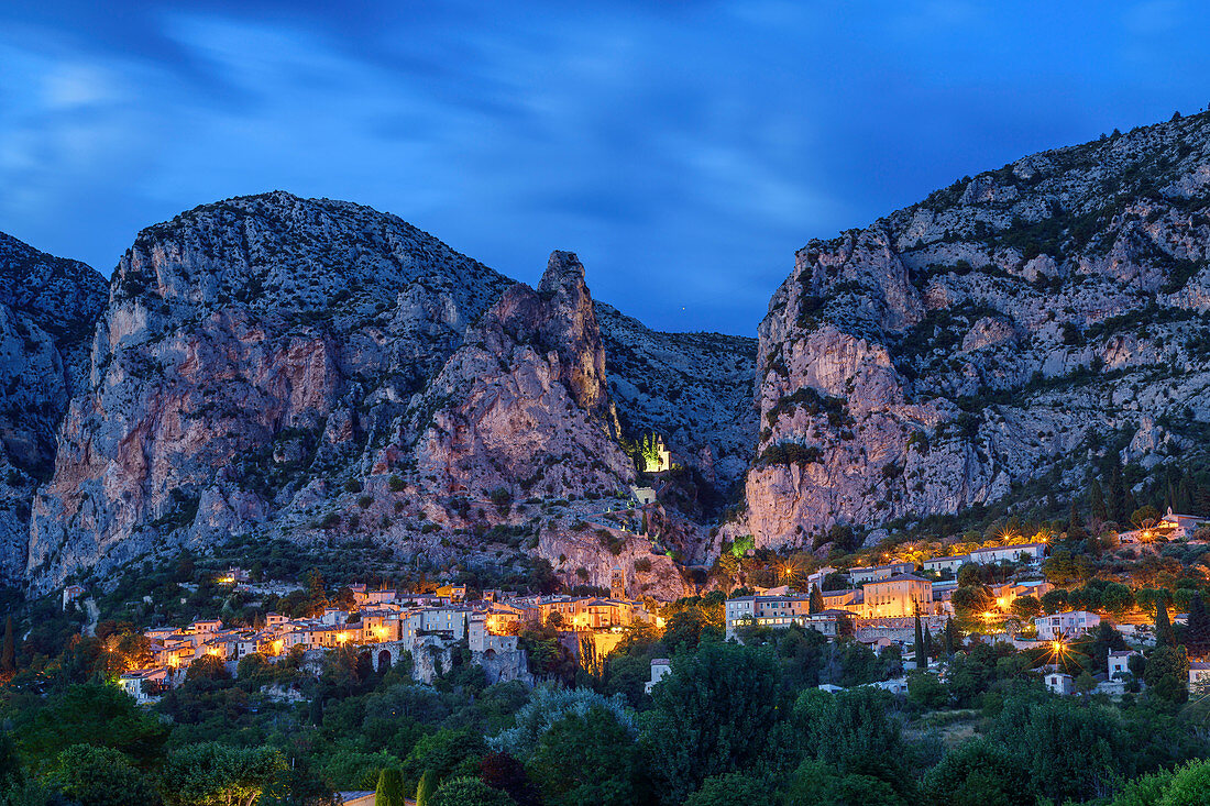 Illuminated mountain village Moustiers-Sainte-Marie, Verdon Nature Park, Alpes-de-Haute-Provence, Provence-Alpes-Cote d´Azur, France