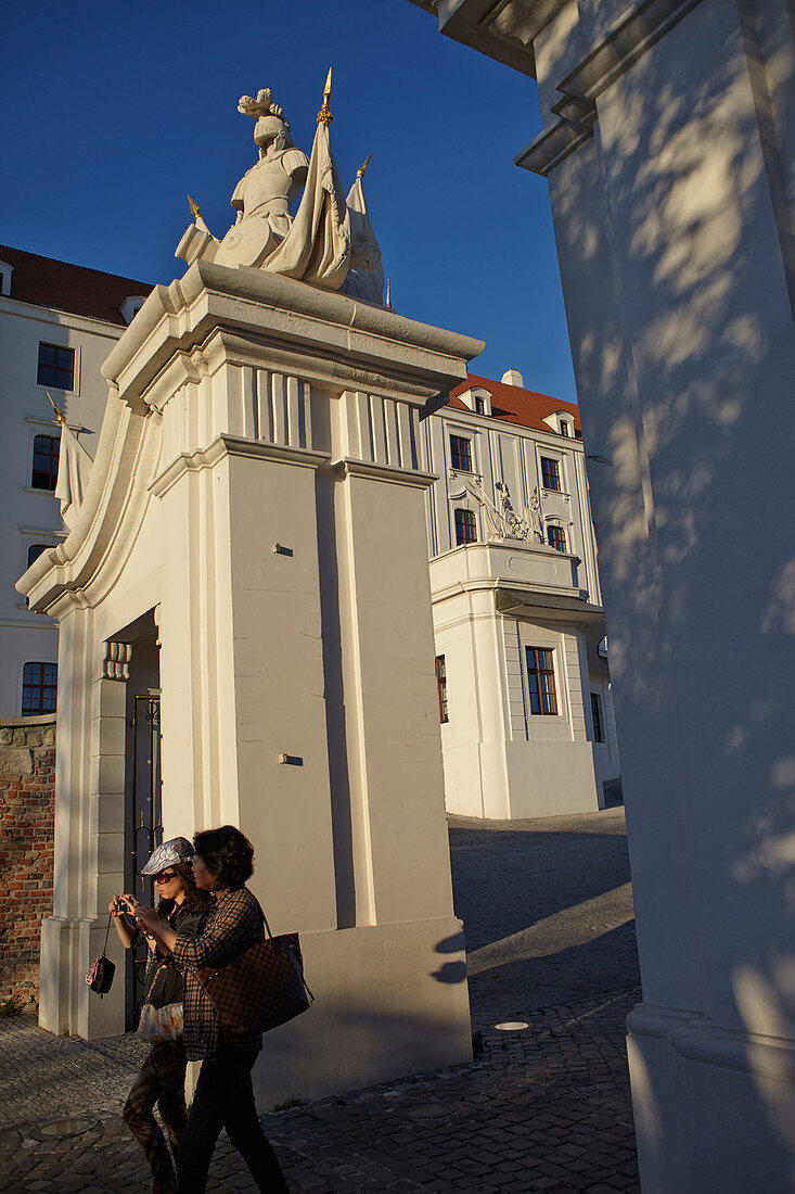 Visitors walk through the gate of Bratislava Castle, Bratislava, Slovakia.