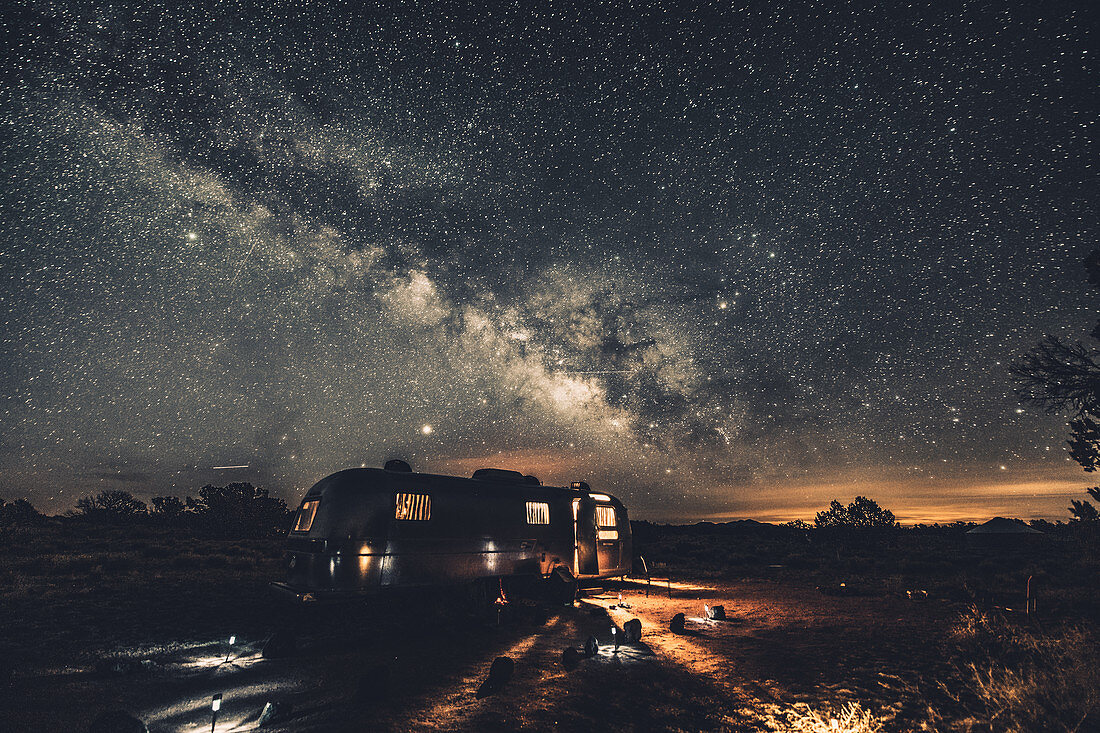 Illuminated Airstream with Milky Way in Williams, Flagstaff, Grand Canyon, Arizona, USA, North America