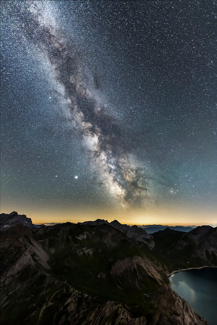 Milky Way on a lake called Lünersee in the Austrian Alps