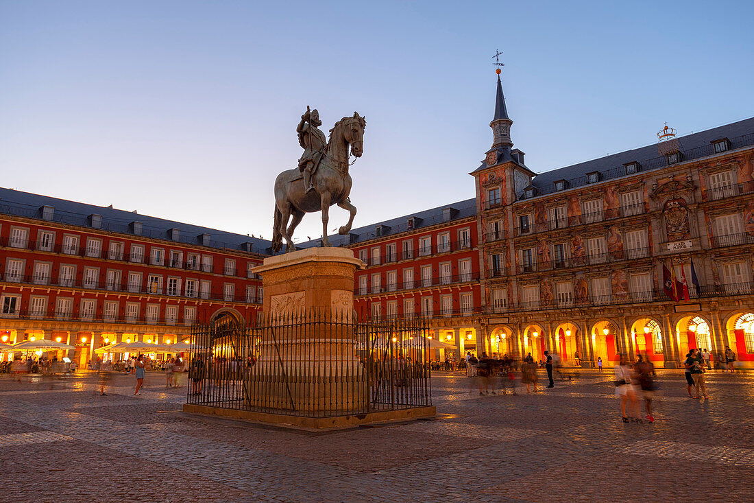 Plaza Major with Philip III statue in the evening, Madrid, Spain