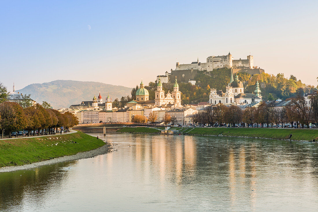 Historical old town of Salzburg reflected in Salzach river with Hohensalzburg Fortress in the background, Salzburg, Salzburger Land, Austria, Europe