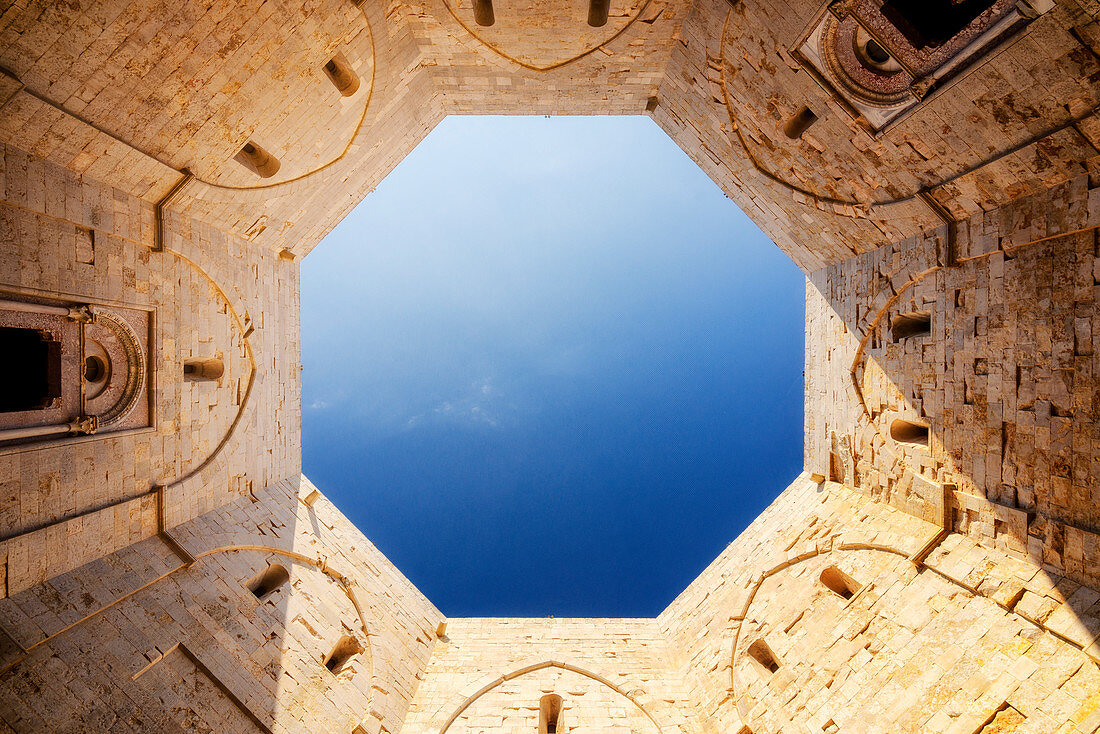 Cutting of sky viewed from the inside courtyard of Castel del Monte fortress in Andria, Apulia region, Italy