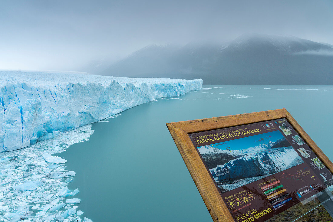 Information plaque and the northern snout of Perito Moreno Glacier. Lago Argentino department, Santa Cruz province, Argentina.