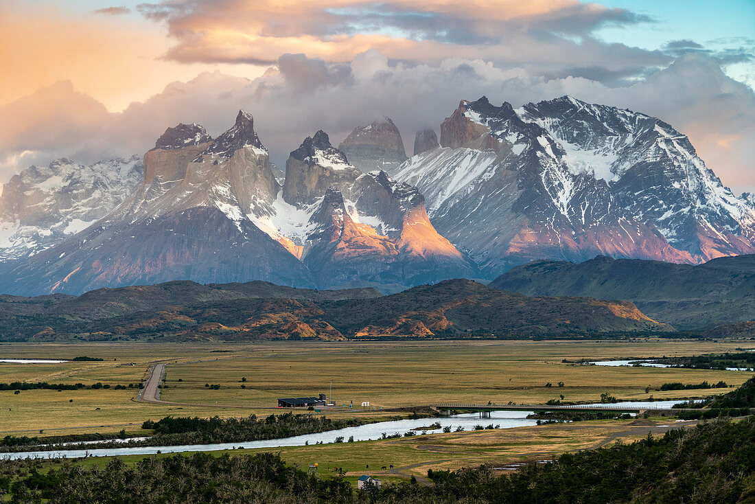 Paine Horns and Cerro Paine at dawn, with Serrano river in the foreground. Torres del Paine National Park, Ultima Esperanza province, Magallanes region, Chile.
