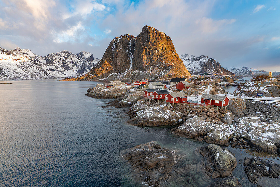 The fishing village with its traditional 'rorbus' at dawn in winter. Hamnoy, Nordland county, Northern Norway, Norway.