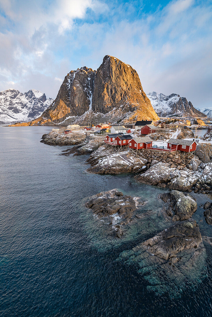 The fishing village with its traditional 'rorbus' in the winter morning light. Hamnoy, Nordland county, Northern Norway, Norway.