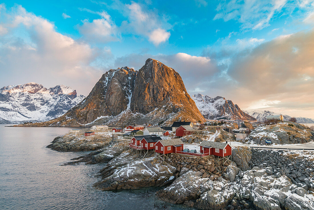 The fishing village with its traditional 'rorbus' at dawn in winter. Hamnoy, Nordland county, Northern Norway, Norway.