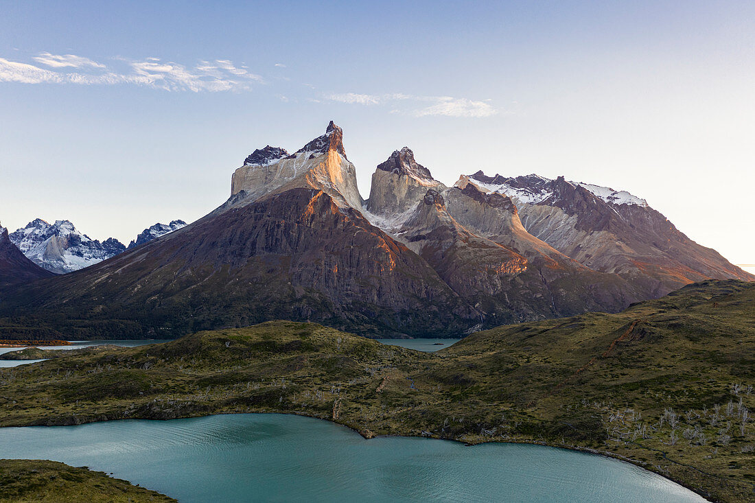Salto Grande waterfall at sunrise with Cuernos del Paine and Cerro Paine peaks. Torres del Paine National Park, Ultima Esperanza province, Chile.