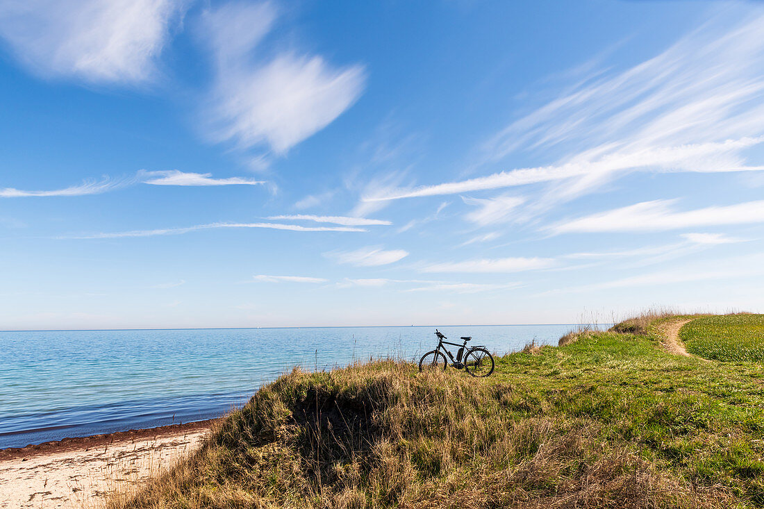 Bicycle on the steep coast of Siggen, Baltic Sea, Ostholstein, Schleswig-Holstein, Germany