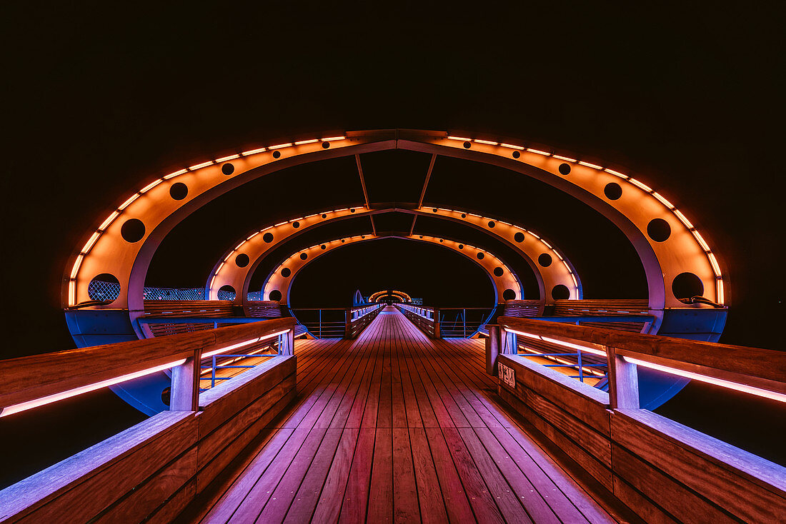 Colored illuminated pier in Kellenhusen, Baltic Sea, Ostholstein, Schleswig-Holstein, Germany