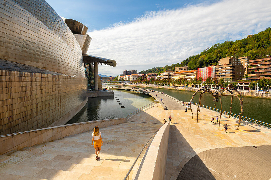 Woman walks at Guggenheim Museum, Bilbao, Basque country, Spain, Iberian Peninsula, Western Europe