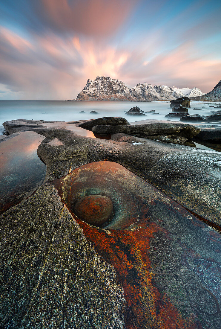 Rock like dragon eye at Uttakleiv beach at sunrise, Leknes, Lofoten, Nordland, Norway, Scandinavia, Northern Europe