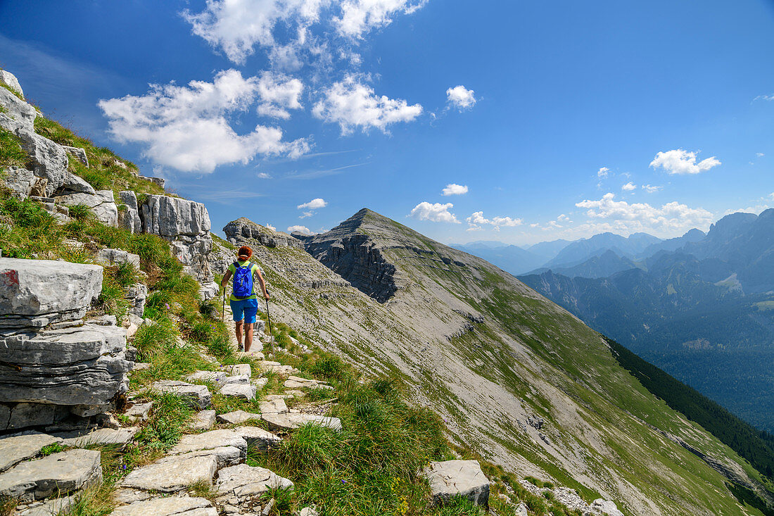 Woman hiking climbs to Soiernspitze, Soiernspitze, Karwendel, Upper Bavaria, Bavaria, Germany