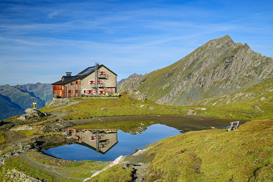 Sudetendeutsche Hut reflected in mountain lake, Nussingkogel in the background, Sudetendeutsche Hut, Granatspitzgruppe, Hohe Tauern, Hohe Tauern National Park, East Tyrol, Austria