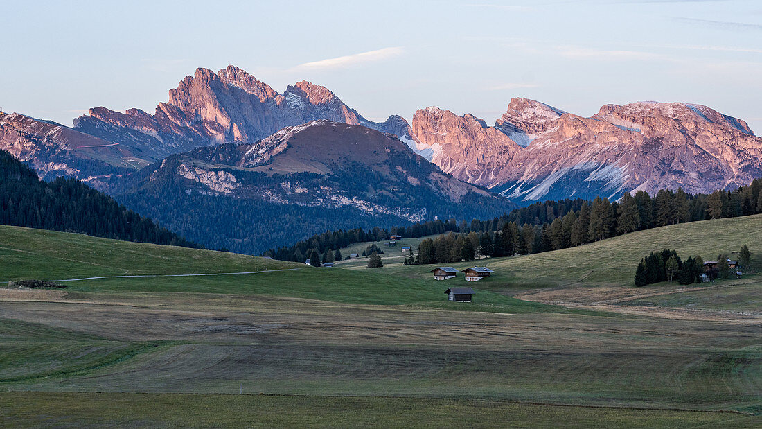 Sunset on the Alpe di Siusi in South Tyrol with a view of the surrounding mountain landscapes