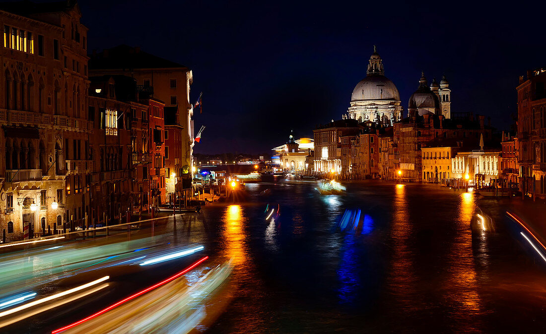 Nocturnal boat traffic on the Grand Canal, Venice, Veneto, Italy