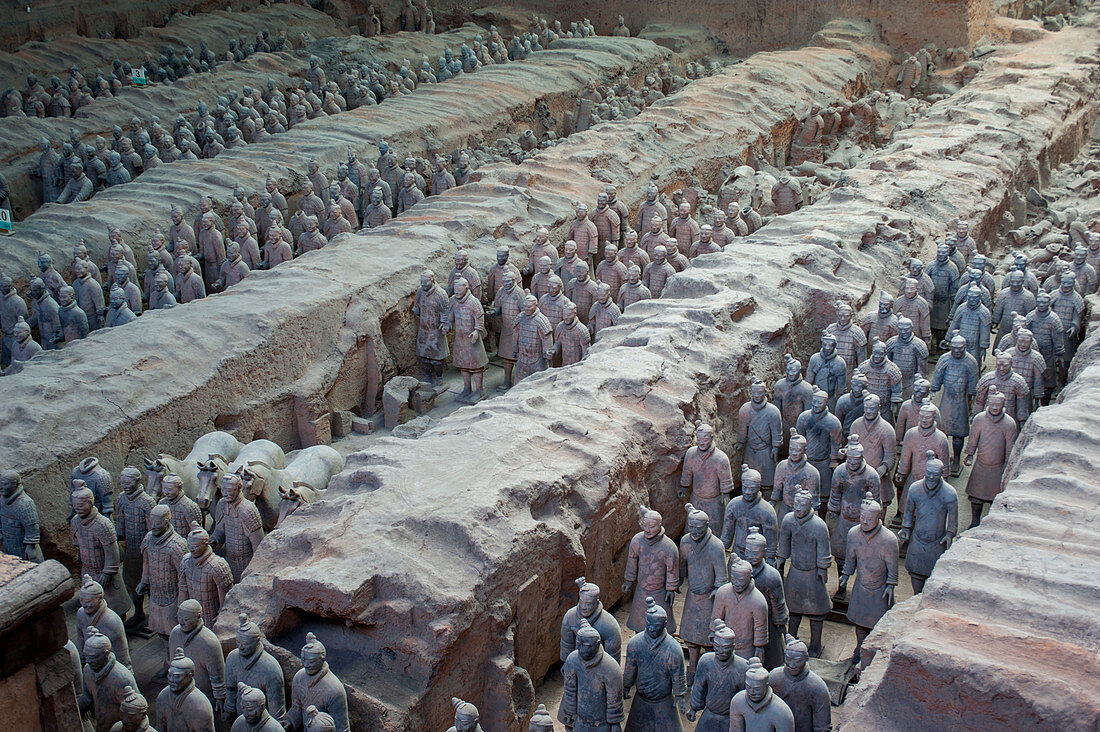 Overview of the Terracotta Army in the Terracotta Warriors and Horses Museum, which is displaying the collection of terracotta sculptures depicting the armies of Qin Shi Huang (259 BC - 210 BC), the first Emperor of China, in Xian, China.