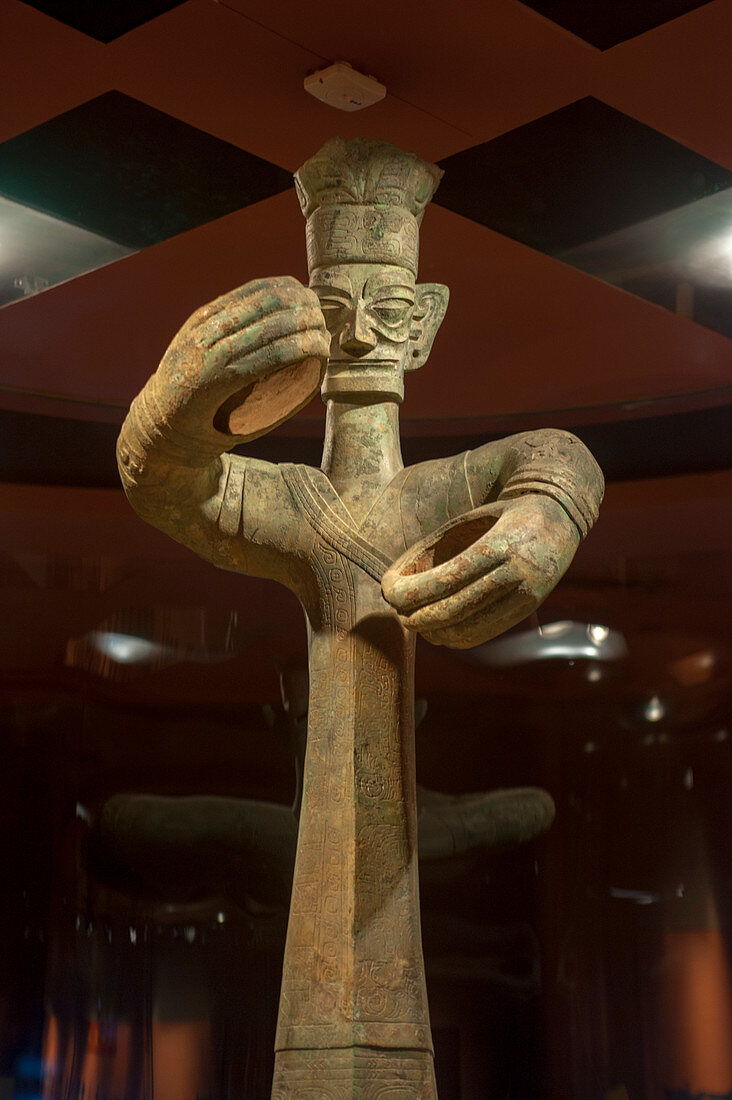 A bronze statue from the 12th century BC in the exhibit of ancient artifacts at the Sanxingdui Museum in Sanxingdui near Chengdu, Sichuan Province in China.
