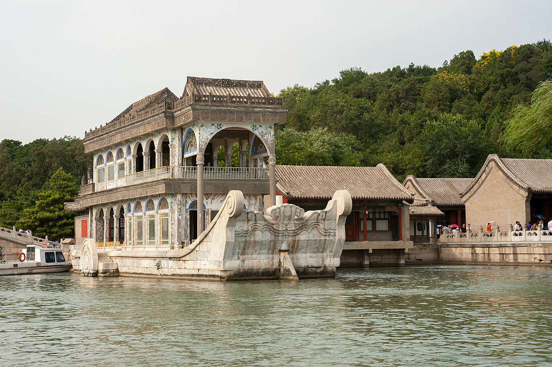 View of the Marble Boat on Kunming Lake with Longevity Hill at the Summer Palace, which was the imperial garden in the Qing Dynasty, in Beijing, China.