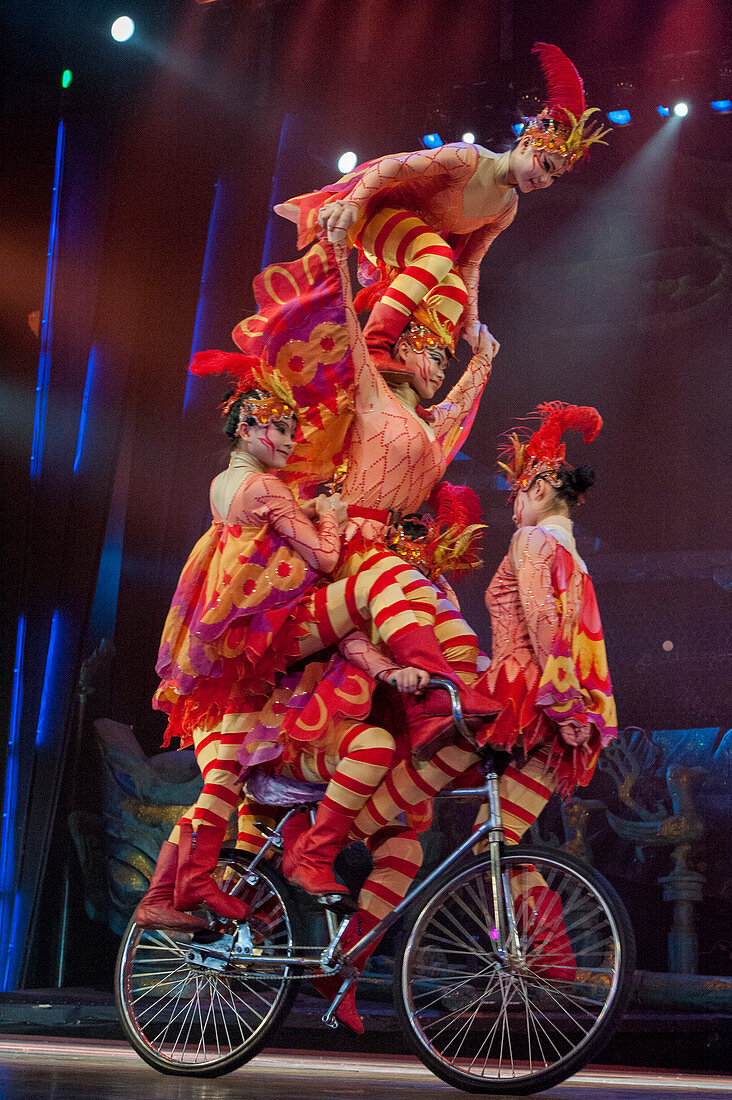 Action packed and colorful acrobatic show with women on a bicycle in Beijing, China.