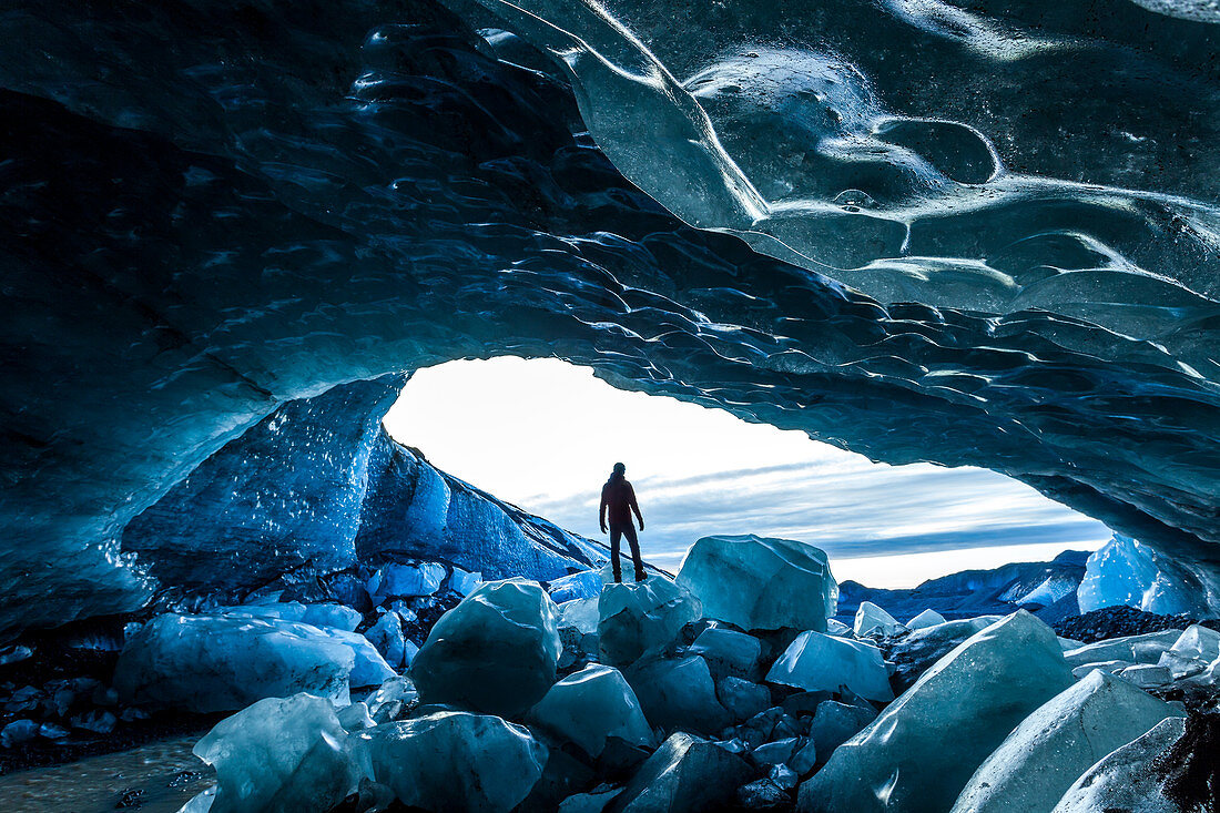 Glacial Ice Cave, Svinafellsjokull glacier, Skaftafell National Park, Iceland. Model Released.