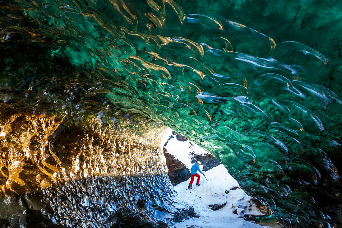 Glacial Ice Cave, Svinafellsjokull glacier, Skaftafell National Park, Iceland. Model Released.