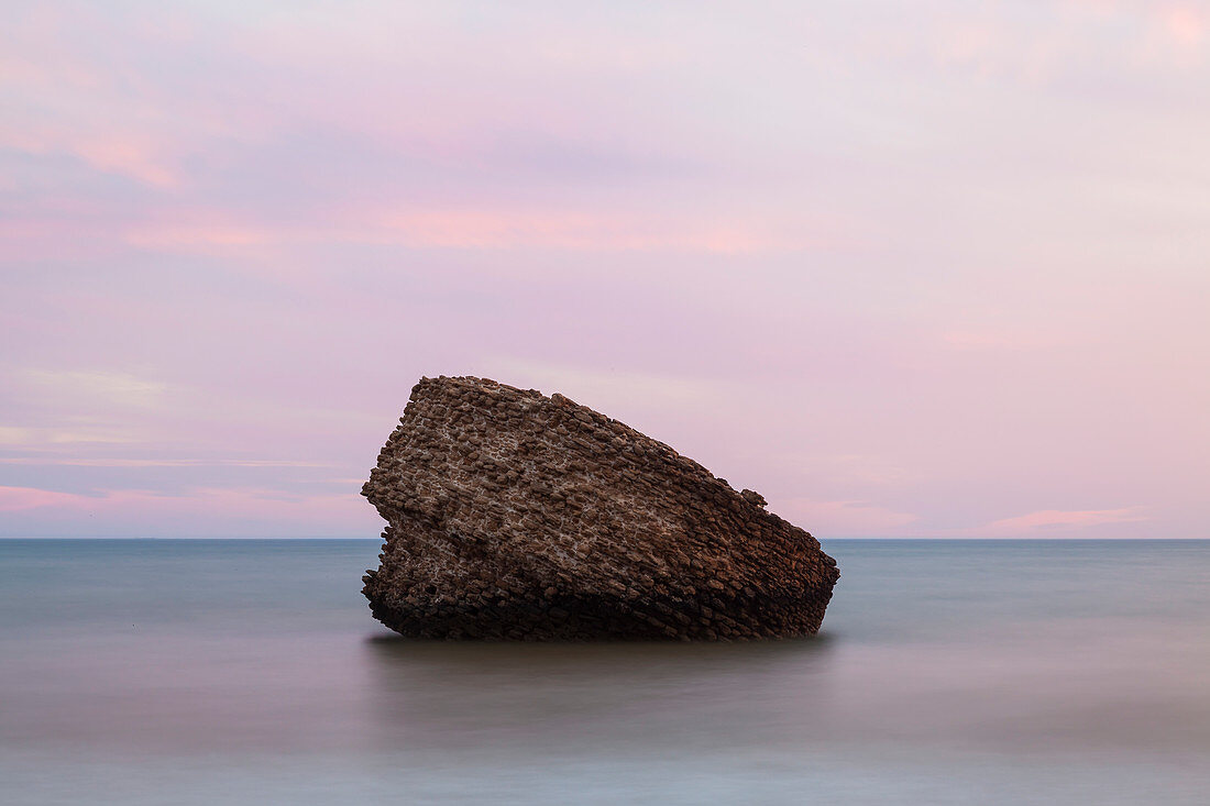 Rock of Higuera at Matalascanas beach at sunset, Andalucia, Spain