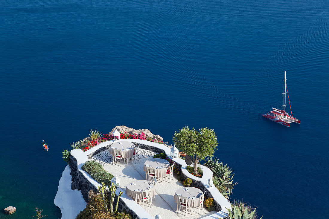 Outdoor dining area, Oia, Santorini, Cyclades islands, Greece