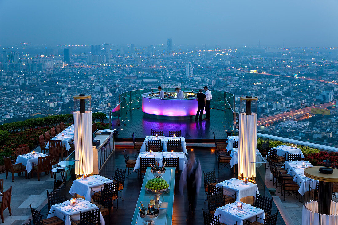 Bangkok, Thailand Stylish outdoor bar at the top of a skyscraper the in evening
