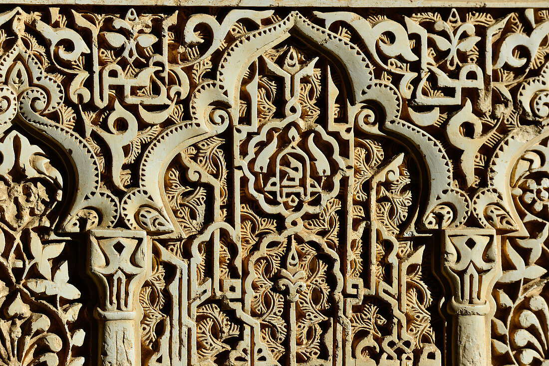 Ancient, Moorish ornamentation on the inner wall of the Alhambra, Granada, Andalusia, Spain