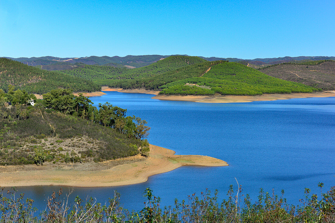 Reservoir in a hilly landscape near Marmelete, Algarve, Portugal