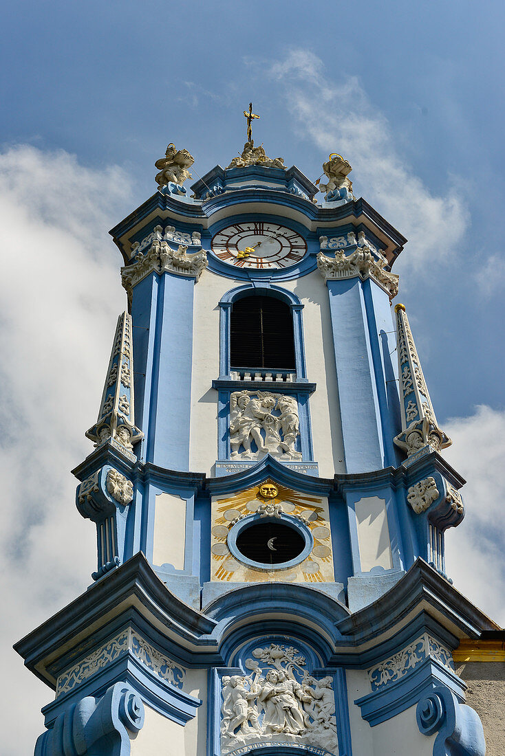Blue church tower with rich decorations in Dürnstein, Wachau, Austria