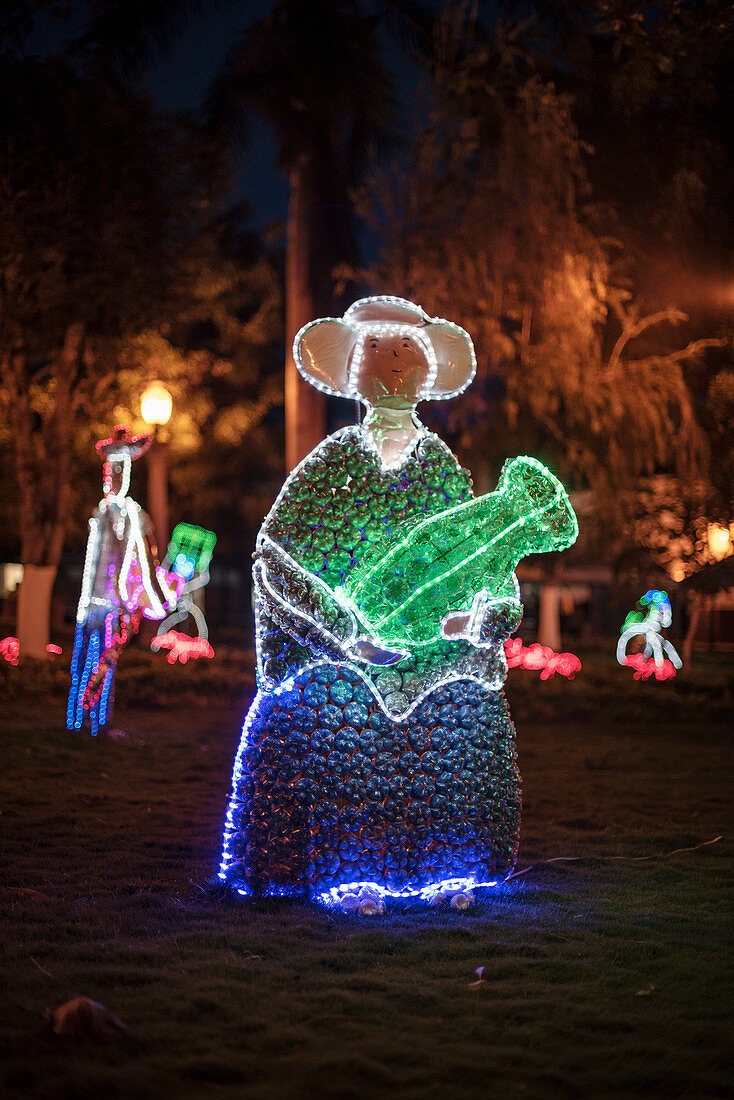 illuminated indogenous figure made from plastic bottles at night, Parque Principal, Barichara, Departmento de Santander, Colombia, South America