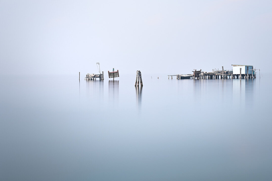 View of the fishing huts on stilts of the fishermen of Pellestrina in the Venetian lagoon, Pellestrina, Veneto, Italy, Europe