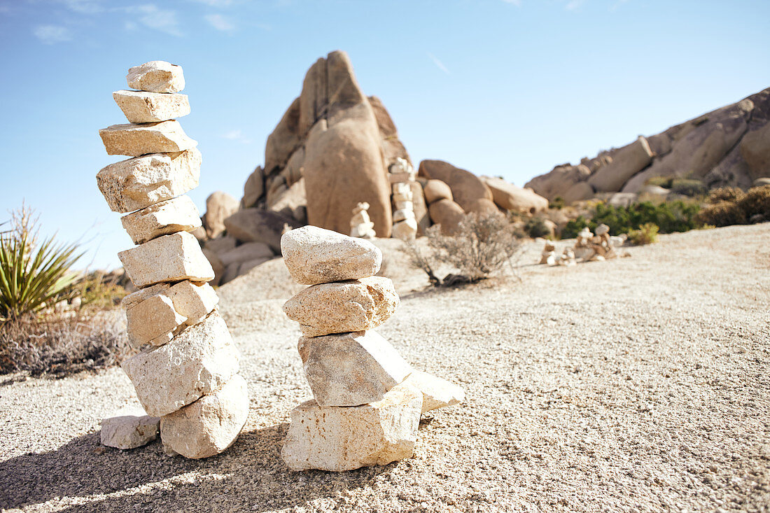 Stone towers against the backdrop of Jumbo Rocks in Joshua Tree Park, California, USA.