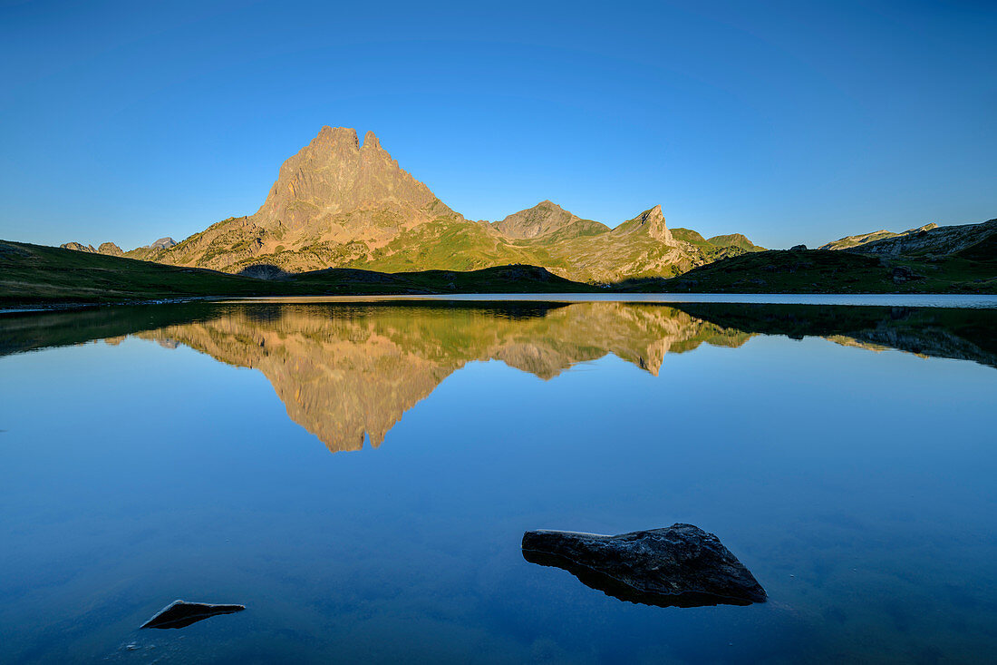 Pic du Midi d'Ossau reflected in mountain lake, Lac Roumassot, Pyrenees National Park, Pyrénées-Atlantiques, Pyrenees, France