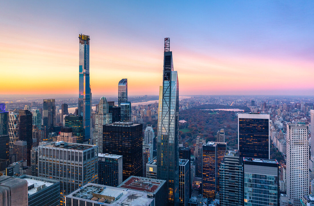 Northern side of Manhattan view from Top Of The Rock Building, with Central park on the background, during sunset. New York, USA.