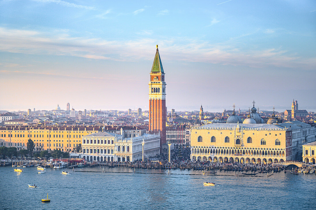 St Mark Square and bell tower during sunset as seen from St. George Island. Venice, Veneto, Italy.