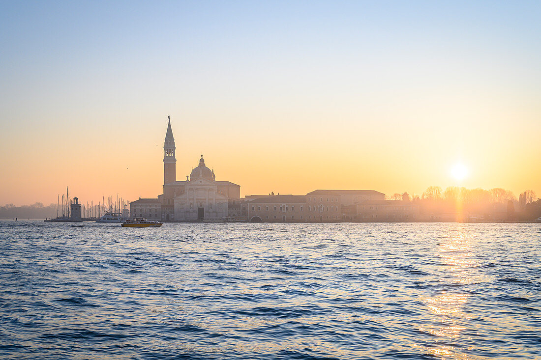 San Giorgio island and church during sunrise as seen from Punta della Dogana. Venice, Veneto, Italy.